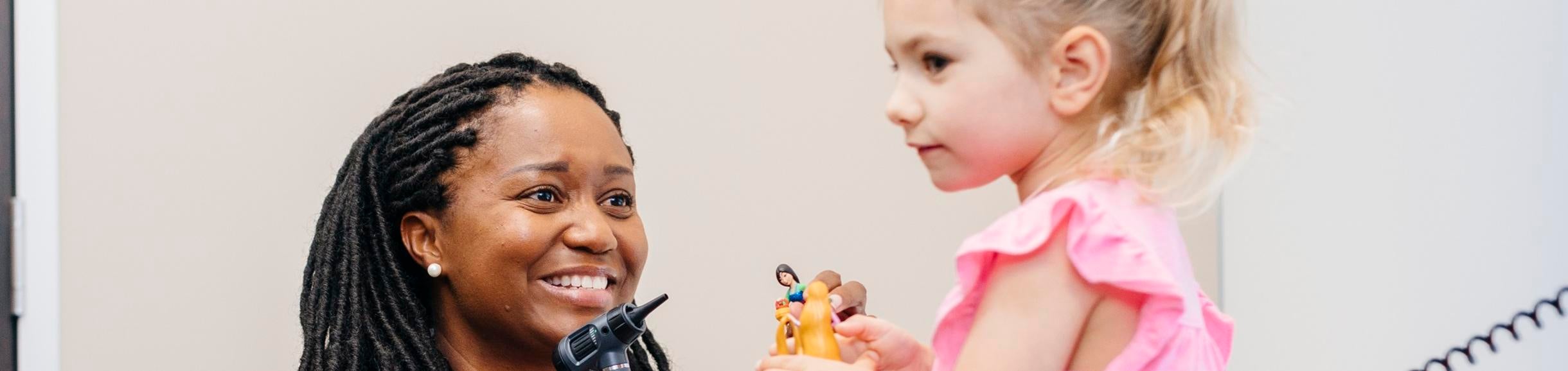 Doctor with young girl