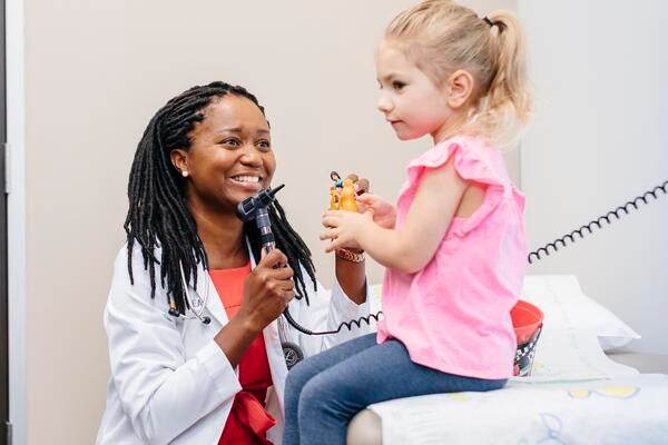 Doctor with young girl